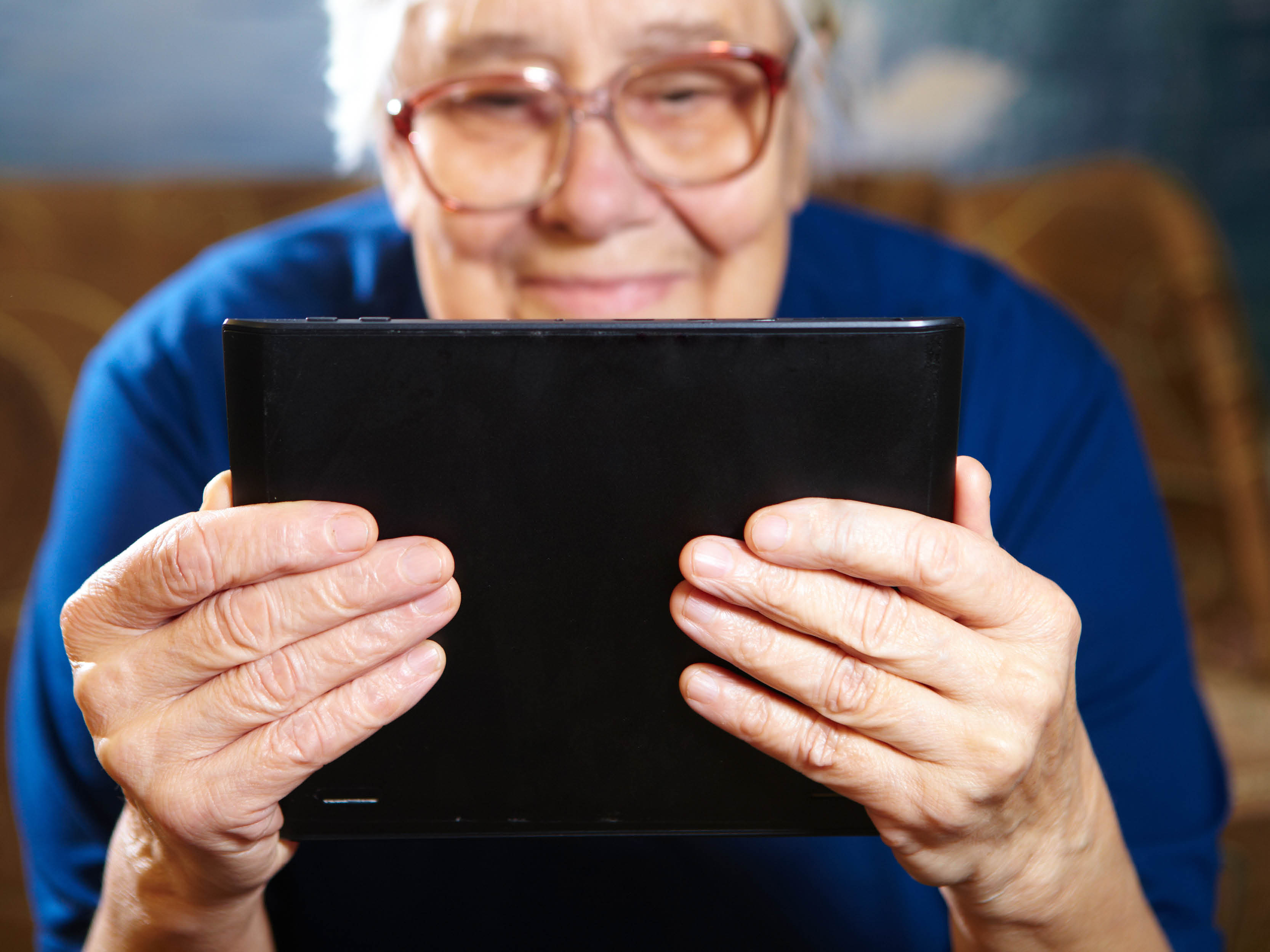 elderly woman using ipad