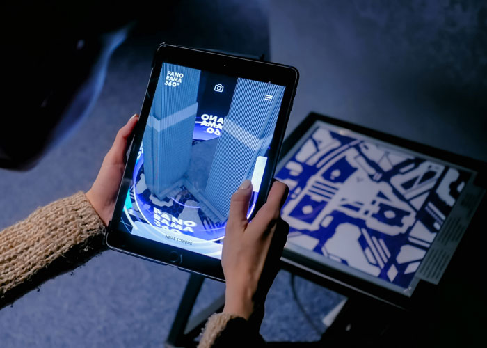 woman using iPad to display augmented reality experience