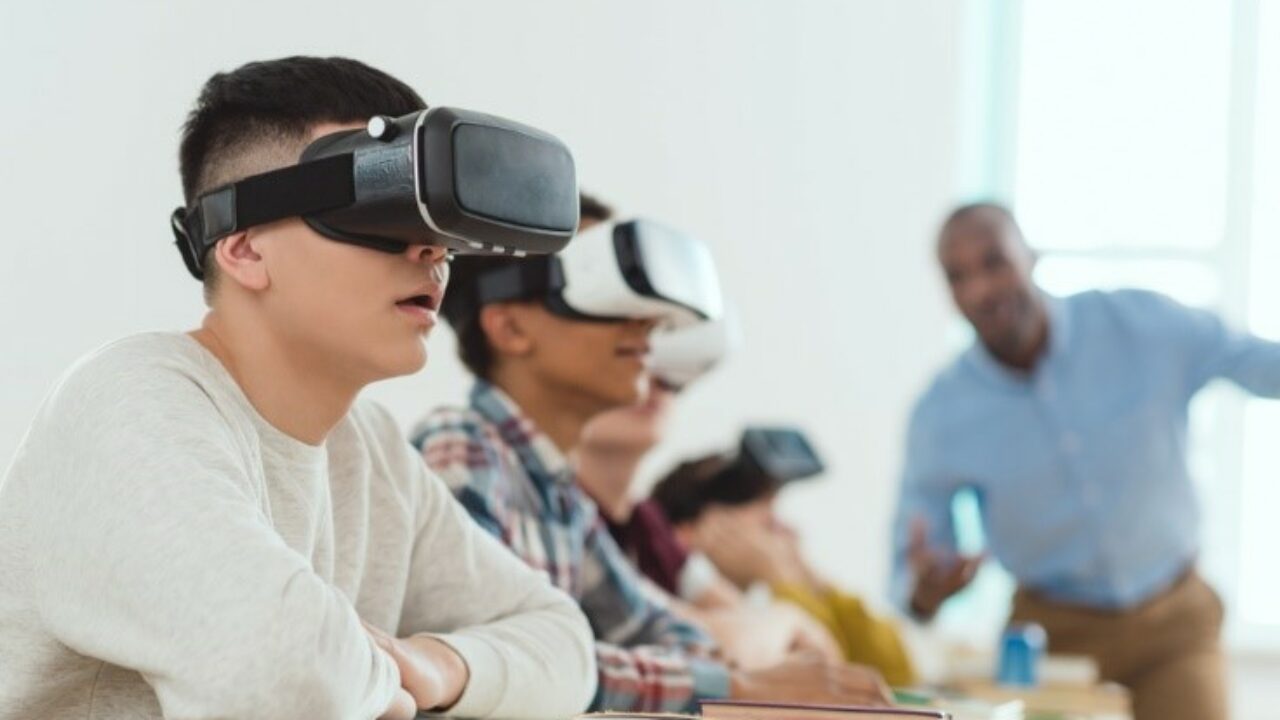 students with virtual reality headsets in a classroom