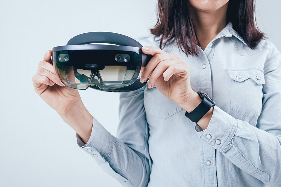 businesswoman holding an augmented reality headset