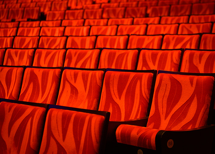 empty movie theatre with red seats